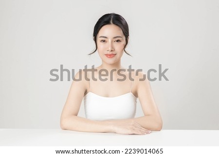 Asian woman with a beautiful face and Perfect clean fresh skin. Cute female model with natural makeup and sparkling eyes on white isolated background. Facial treatment, Cosmetology, beauty Concept. Royalty-Free Stock Photo #2239014065