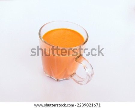 Cup of a milk tea creamy milktea caj (chai) or chaay milk shaicup a famous beverage of South Asia India Pakistan closeup image stock photo
