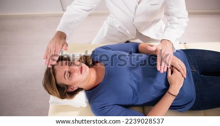 Reiki Therapy Alternative Healing Massage For Man Royalty-Free Stock Photo #2239028537