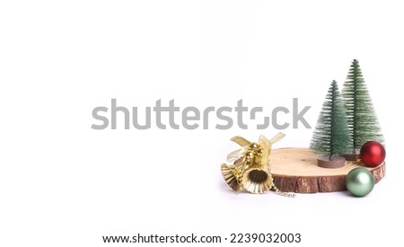 Merry Christmas mock up setups on white background. Xmas tree, jingle bells, wooden slice disc.