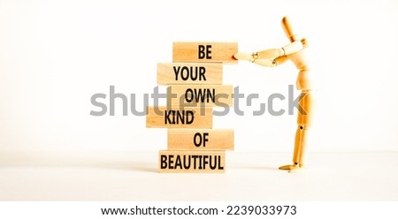 Be beautiful symbol. Concept words Be your own kind of beautiful on wooden blocks on a beautiful white table white background. Businessman icon. Business be your own kind of beautiful concept.
