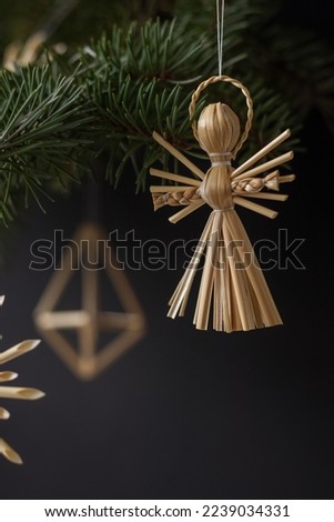 Christmas decorations are made of straw. Christmas decor. Small depth of field
