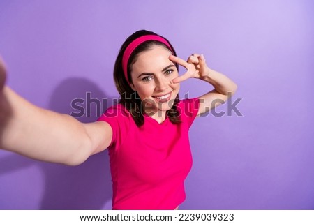 Photo of cute lady pink outfit make instagram facebook twitter post content v-sign eye empty space isolated on purple color background
