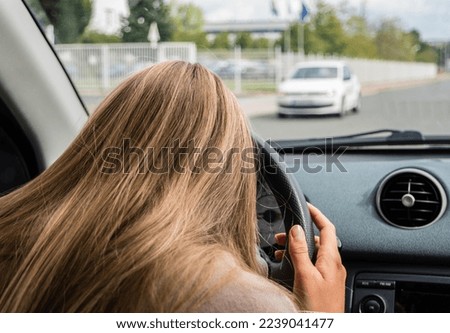 Microsleep at the wheel of a car Royalty-Free Stock Photo #2239041477