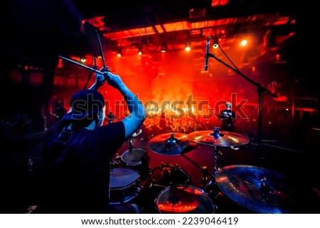Rock concert poster. A drummer plays drums during a show. Band on a stage club.
 Royalty-Free Stock Photo #2239046419