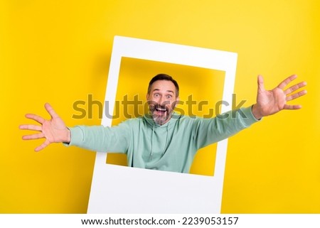 Photo of positive optimistic impressed nice guy dressed mint sweatshirt opened arms invite you hug isolated on yellow color background
