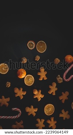 Gingerbread with candy cane isolated on a black background 