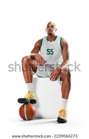 Basketball player sitting resting. Professional basketball player sitting in white background