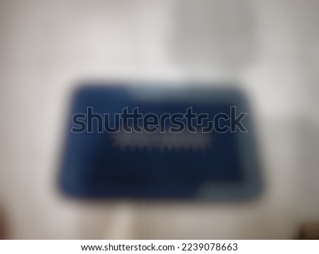 Defocused or blurred abstract background of a soft blue doormat that placed in front of the door and it can absorb the water. It is a waterproof product.