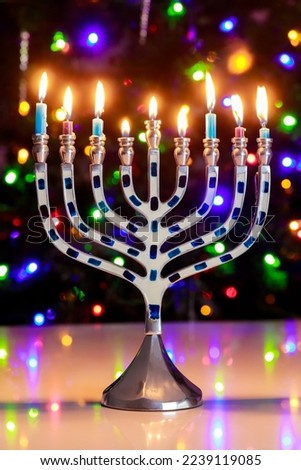 A burning menorah with nine candles is a tradition during Hanukkah.