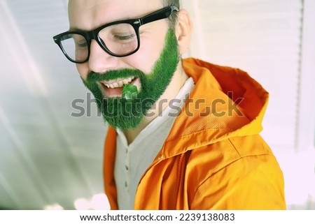 Shocked and happy. Happy saint patricks day. Bearded man with wide open eyes celebrating saint patricks day. Hipster in leprechaun hat and costume. Irish man with beard wearing green.