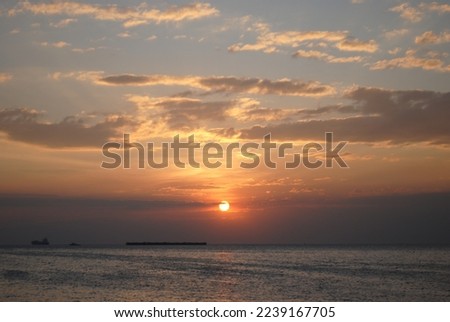 Magic sunset by the sea Royalty-Free Stock Photo #2239167705