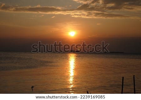 Magic sunset by the sea Royalty-Free Stock Photo #2239169085
