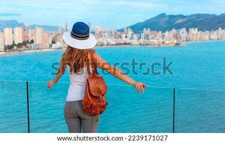 Woman tourist enjoying panoramic skyline view- Benidorm,  Alicante province in Spain
