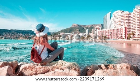 Woman tourist enjoying Calpe city and tropical beach, Alicanta, Spain