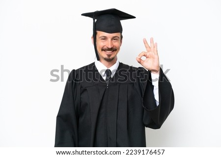 Young university graduate man isolated on white background showing ok sign with fingers