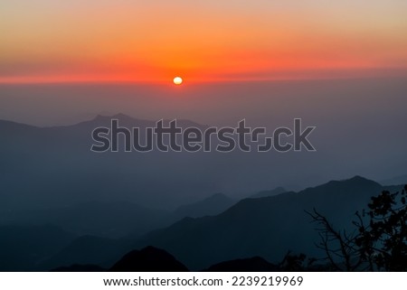 Abha, Saudi Arabia, December 10th 2021- A landscape picture of the sunset from to the tops of the Al-Soudah Mountains, southern Saudi Arabia