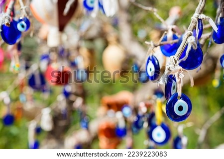 Evil eye charms hang from tree in Cappadocia Turkey for good luck