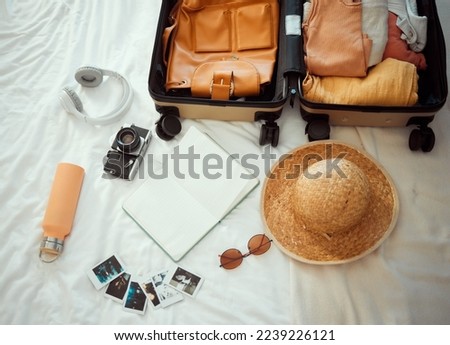 Backpacking, suitcase and equipment for summer travel, vacation or holiday getaway kit preparation on bed. Tourism, packing and items for traveler, trip or tourist adventure, explorer gear in bedroom