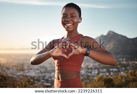 Black woman, fitness and heart hands on mountain with music for outdoor sports motivation portrait, travel exercise and freedom. African woman, happy athlete and love sign for hiking with podcast Royalty-Free Stock Photo #2239226311