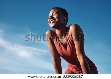 Fitness, black woman and smile in relax for running, exercise or workout in the nature outdoors. Happy African American female runner smiling on a break from run, exercising and breathing fresh air Royalty-Free Stock Photo #2239226387