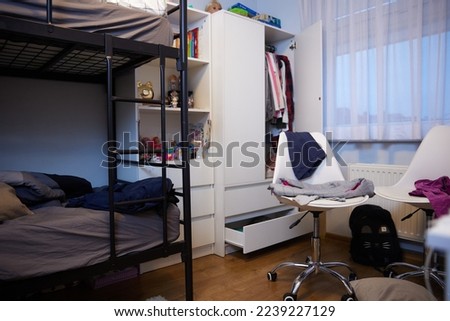 mess, disorder and interior concept - view of messy home kid's room with scattered stuff Royalty-Free Stock Photo #2239227129