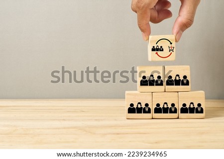 hand stack wood cube organized as customer base repeat buying make business grow Royalty-Free Stock Photo #2239234965