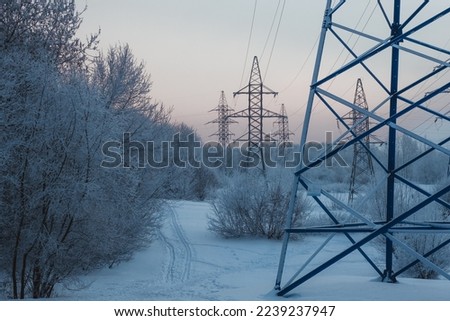 Winter, snowfall. Power lines in the snow. High quality photo Royalty-Free Stock Photo #2239237947