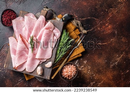 Flat slices of square sandwich ham with herbs. Dark background. Top view. Copy space. Royalty-Free Stock Photo #2239238549