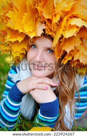 beautiful young woman in autumn park 