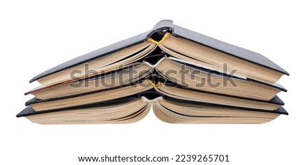 Open books stack heap turned over, upside down isolated on white background. Old classic novels, literature. High quality photo