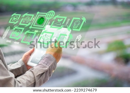 person use tablet touch screen save energy,reduce global warming,climate change,eco friendly investment,ESG environment social governance,Green Business Innovation and Sustainable Development concept.