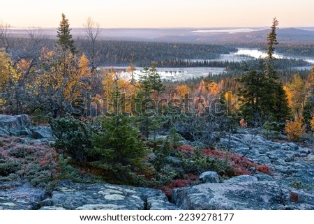 A view from a rocky Iso Pyhätunturi peak on an autumn morning in Salla National Park, Northern Finland	