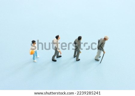 Concept image on age. Characters from young to old. Life cycle Royalty-Free Stock Photo #2239285241
