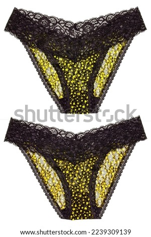 Underwear woman isolated. Set of luxurious elegant black lacy thongs panties with colorful yellow stars pattern isolated. Clipping path. Macro. Underwear fashion.Two views.