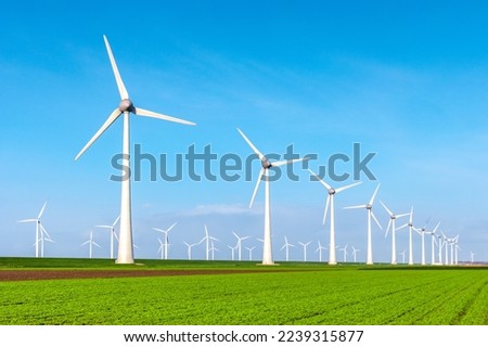 Windmill turbines in the Netherlands aerial view of wind energy park Royalty-Free Stock Photo #2239315877