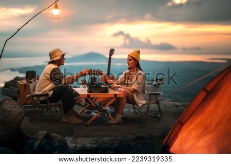 Asian couple sweet in tent inside on they camping trip, traveller relax and sleep togather in out door and camping trip Royalty-Free Stock Photo #2239319335