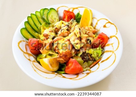 Green salad with arugula, lamb and tomatoes. Healthy vegan dish. Top view at table.
