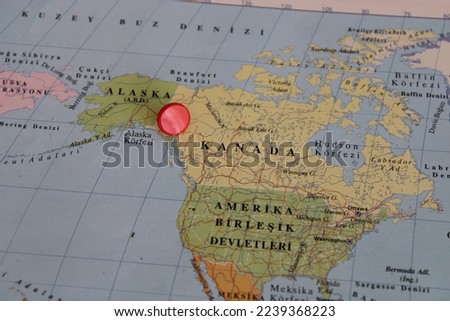 canada location on map with red thumbtack, travel idea, ottowa on map with a red fastener, vacation and road trip concept, pinned destination, top view