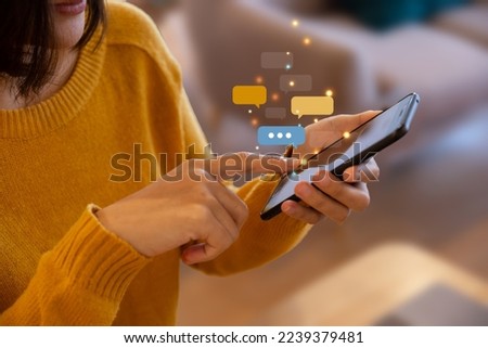 Hand of young woman using smartphone for chat and communication. Digital media website and social network. Royalty-Free Stock Photo #2239379481