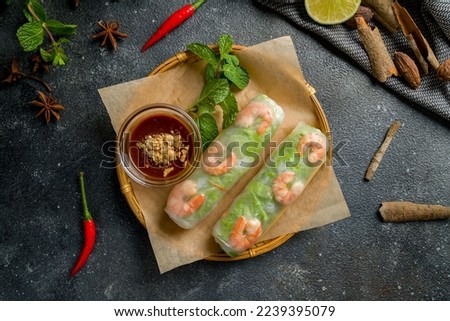 Fresh Spring Roll with shrimps, Vietnamese Food top view on dark table Royalty-Free Stock Photo #2239395079