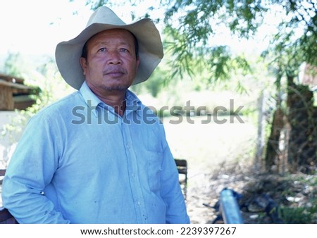  Alone old Thai man, dark skin, face, mouth, white beard, indigenous people, close-up.                             