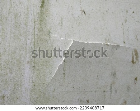 the background of a cracked wall due to a collision with a hard object.