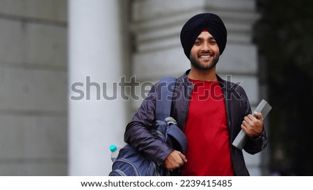 sikh college student image Young punjabi boy with confidence and bag Royalty-Free Stock Photo #2239415485