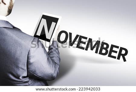 Business man with the text November in a concept image 