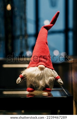 Red christmas elf in hat. Cute dwarf. santa