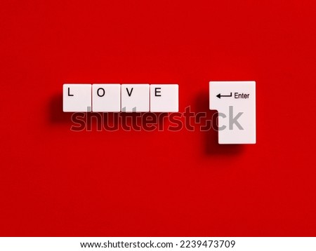 Online dating. To search and find love on the internet or social media applications concept. Computer keyboard keys with the word love.