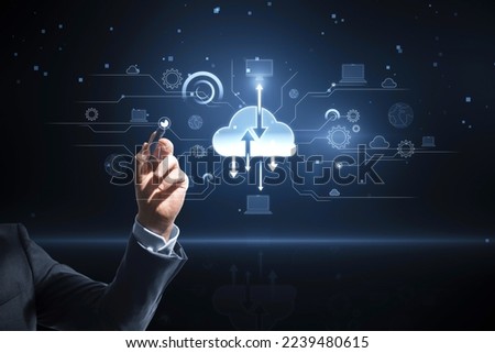 Close up of businessman hand pointing at digital cloud computing hologram on blurry background. Cloud data, server, service and hosting concept