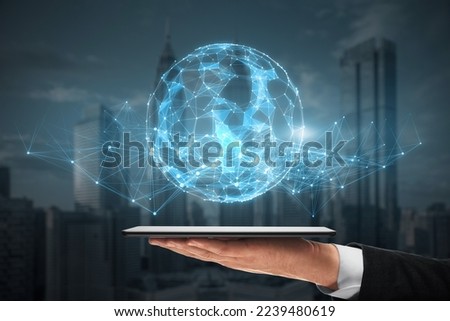 hand holding cellphone with glowing polygonal sphere on blurry night city background. Futuristic technology wireframe mesh polygonal element. Connection Structure. Digital Data Visualization. 