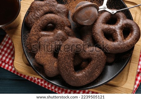 Concept of tasty bakery, gingerbread cookies in chocolate, close up